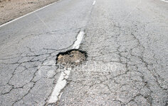 ist2_234266-pothole.jpg