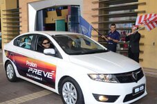 Dato Sri Syed Zainal - left flagging off convoy at Sri Pentas with Ahmad Izham Omar.jpg